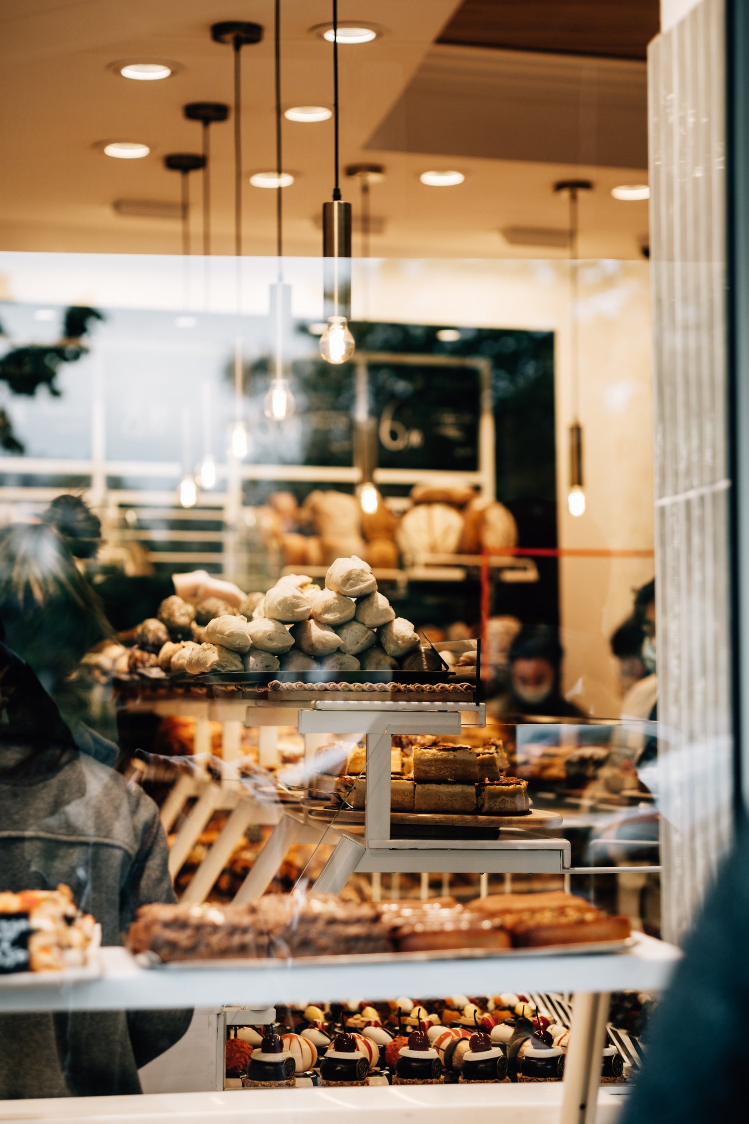 Bakery display with pastries, breads and desserts showing premium retail presentation for Dough Pro